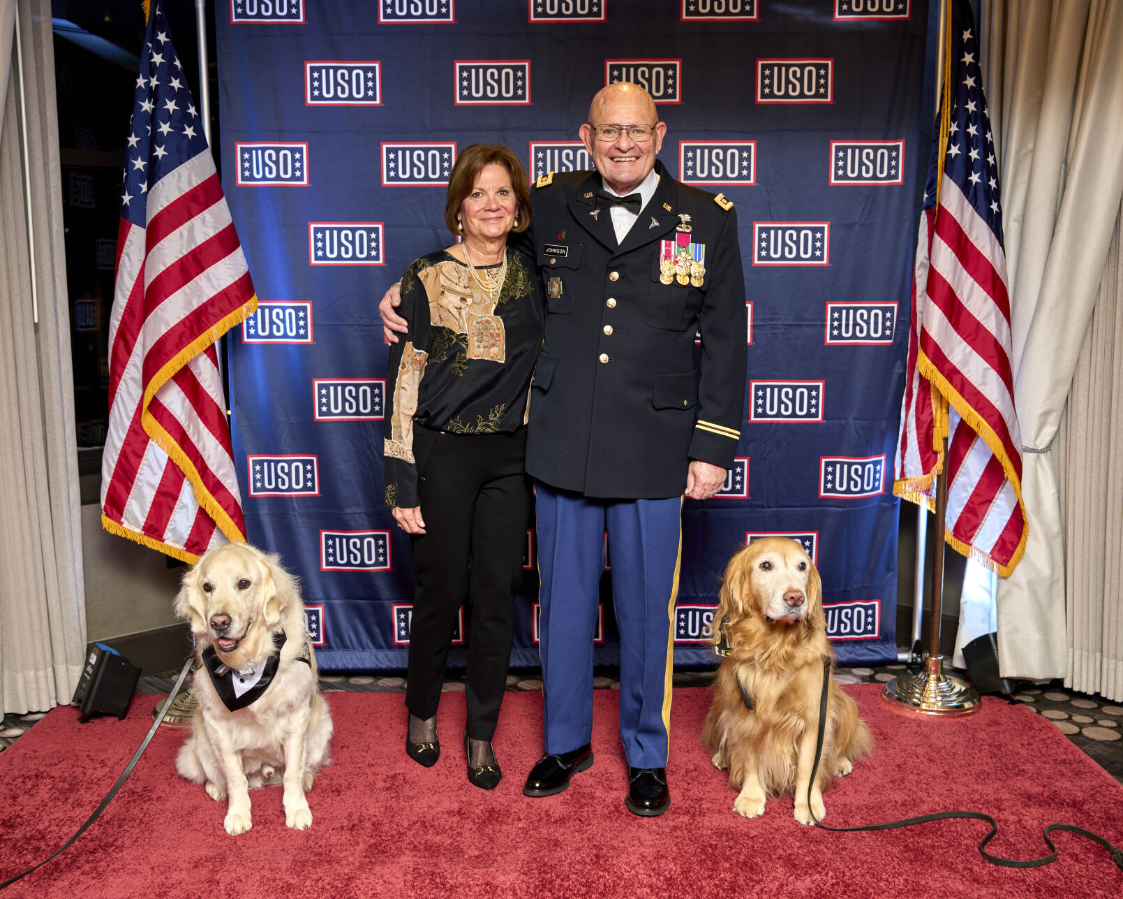 Party guests with K-9 Comfort Dogs. (Photo courtesy of USO)